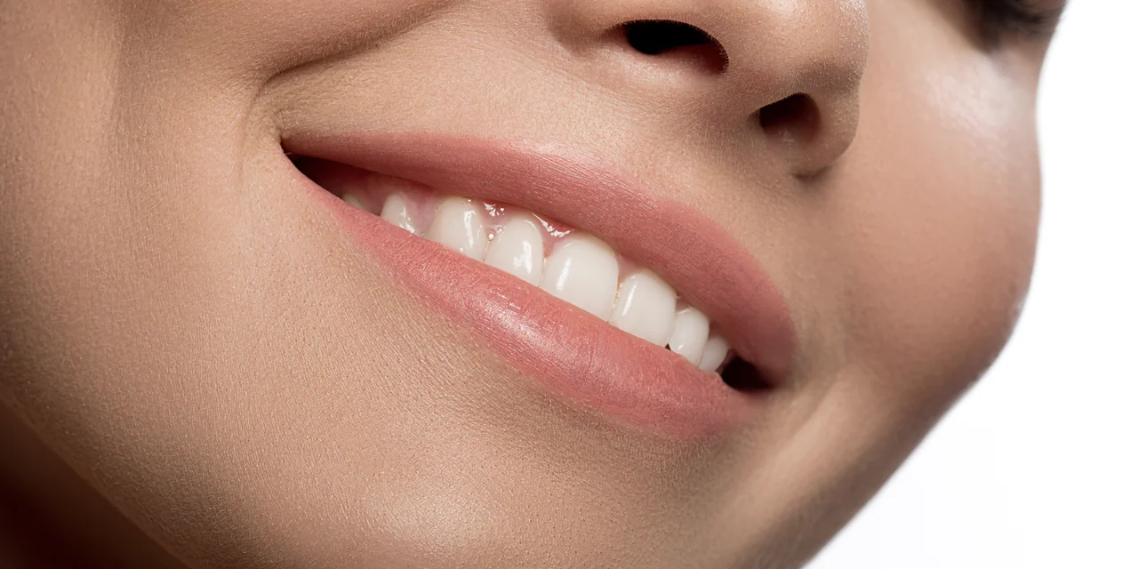 Close-up of a person smiling with healthy natural teeth